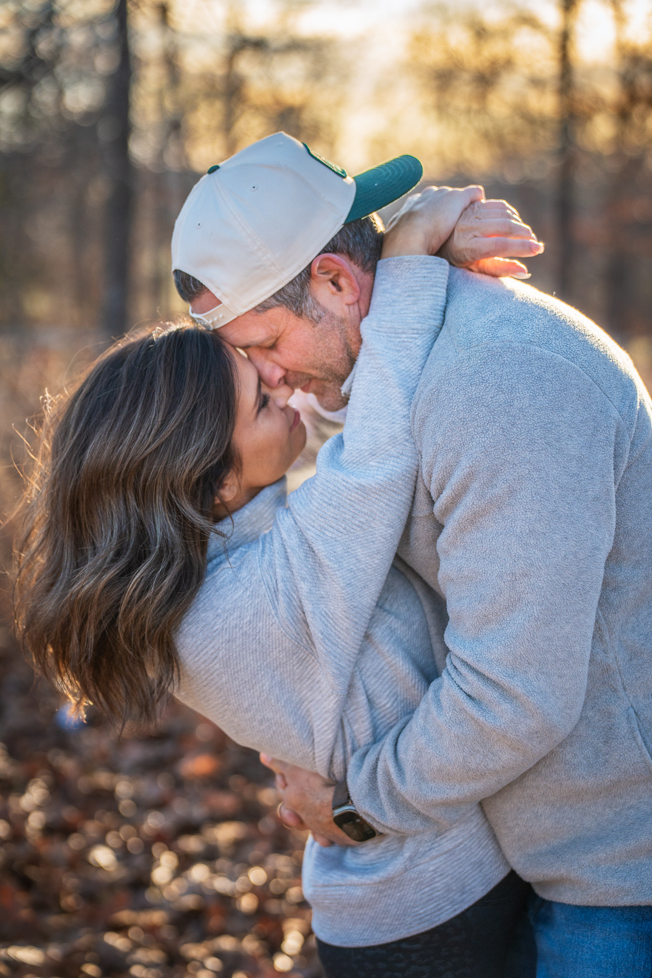 Couple's hands with engagement ring
