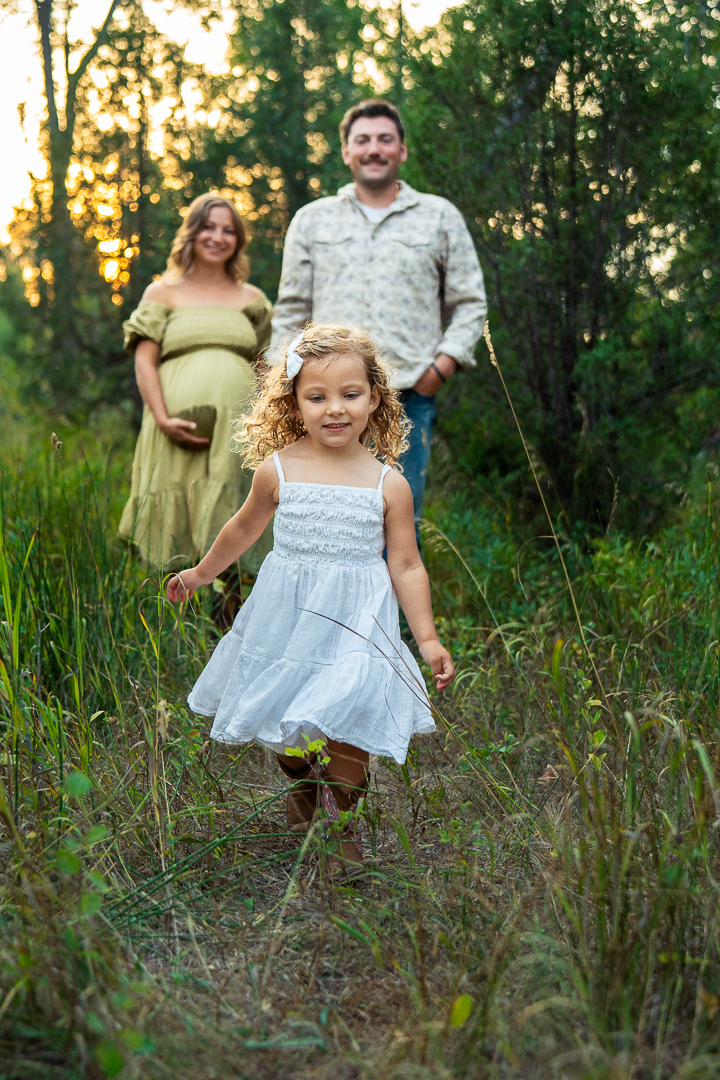 Children playing in tall grass