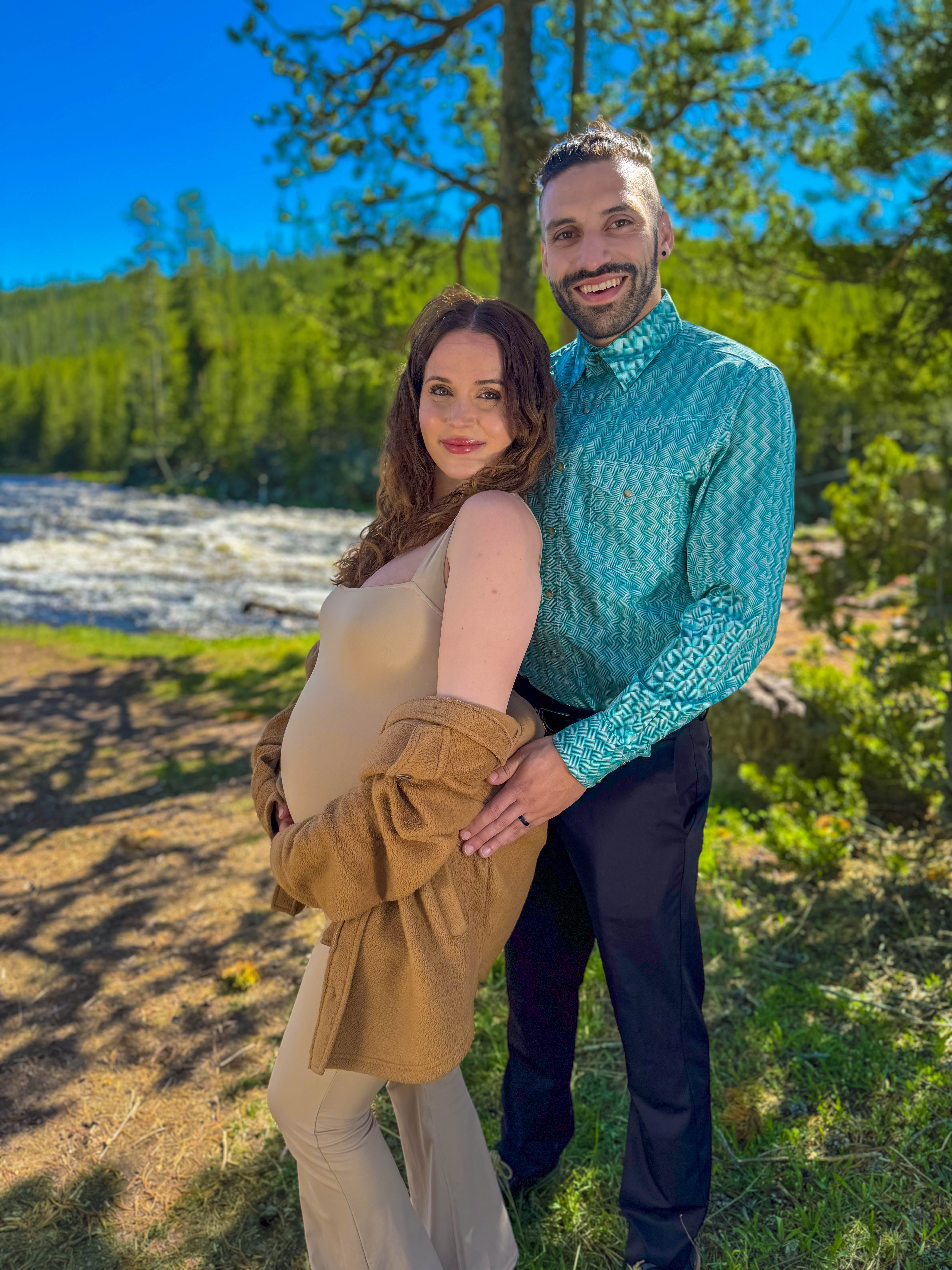 Pregnant woman holding belly